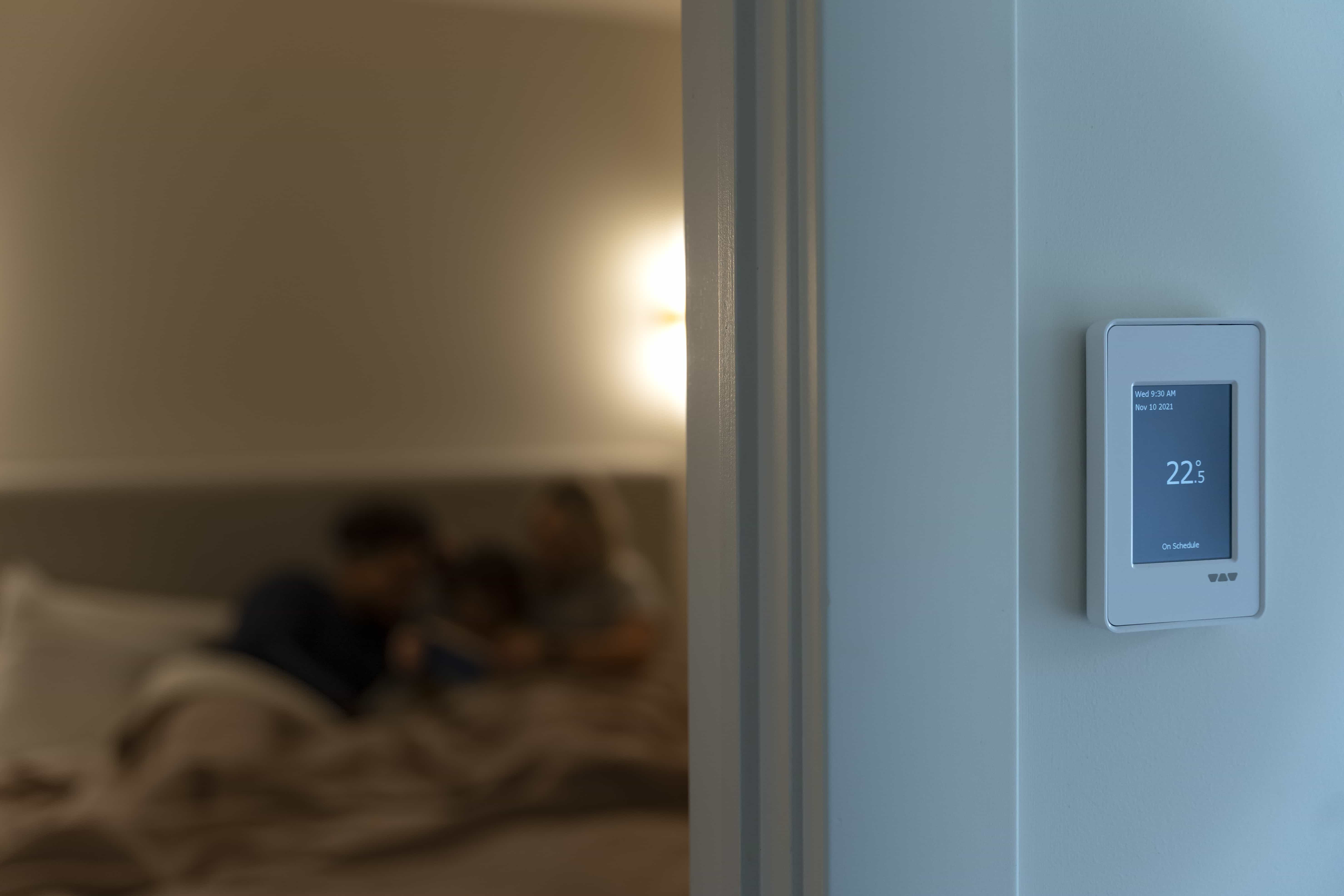 Indoors of a house where a temperature regulator shows 22.5 degrees